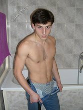 Dark-haired twink takes off his underwear in the bathroom