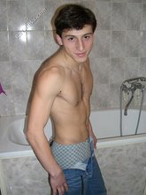 Dark-haired twink takes off his underwear in the bathroom
