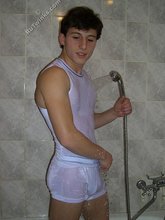 Six-pack sporting dark-haired twink shows his cock