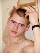 Buzzcut-sporting guy posing and showering