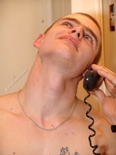Buzzcut-sporting guy posing and showering