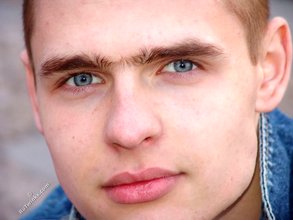 Denim-loving guy posing outdoors, looking mean/lean