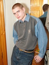 Denim-loving guy posing outdoors, looking mean/lean