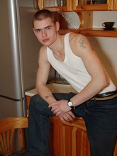 Denim-loving guy posing outdoors, looking mean/lean