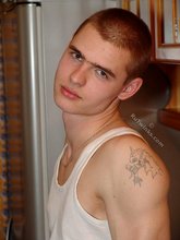 Denim-loving guy posing outdoors, looking mean/lean