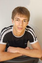 Black t-shirt dark-haired dude showing his body