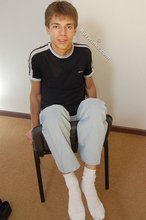 Black t-shirt dark-haired dude showing his body