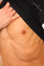 Black t-shirt dark-haired dude showing his body