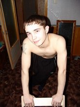 Brown-eyed twink posing half-naked and touching himself