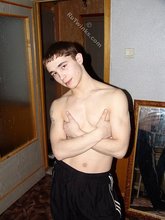 Brown-eyed twink posing half-naked and touching himself