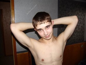 Brown-eyed twink posing half-naked and touching himself