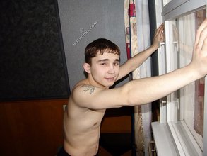 Brown-eyed twink posing half-naked and touching himself