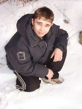 Gorgeous twink posing while squatting outdoors