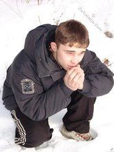 Gorgeous twink posing while squatting outdoors