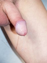 Big-dicked twink sucking on a dildo toy like a slut