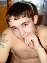 Dark-haired twink thinking about something deep