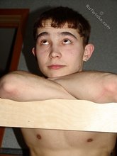 Dark-haired twink thinking about something deep
