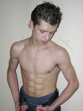 Spiked hair seductive twink showing his ass