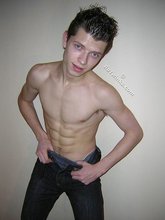 Spiked hair seductive twink showing his ass