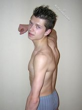 Spiked hair seductive twink showing his ass