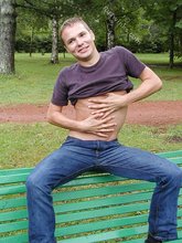 Blonde guy showing his sexy body outdoors