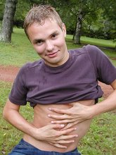 Blonde guy showing his sexy body outdoors