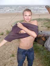 Blond-haired twink showing his naked cock outdoors
