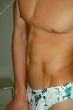 Blond-haired twink showing off his sexy abs on cam