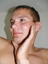 Blond-haired guy showing his feet and his ass