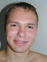 Submissive-looking twink doing splits on camera