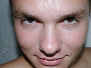Submissive-looking twink doing splits on camera