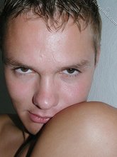 Submissive-looking twink doing splits on camera