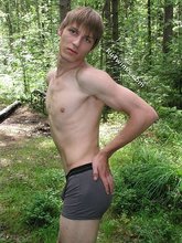 Blond-haired hottie gets naked in the forest