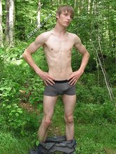 Blond-haired hottie gets naked in the forest