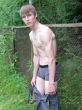 Blond-haired hottie gets naked in the forest