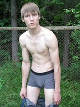 Blond-haired hottie gets naked in the forest