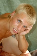 Blue-eyed and blond-haired hottie shows that ass