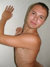 Brown-eyed and jacked-up dude showing his body