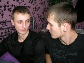 Two luxurious gay boys posing together on a bed