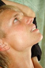 Blond-haired albino twink shows his soles and more