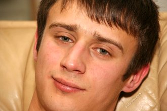 Sporty dark-haired twink takes his t-shirt off