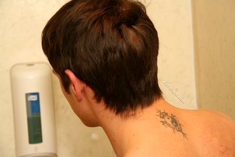 Blue-eyed twink showing his half-naked body