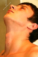 Blue-eyed twink showing his half-naked body