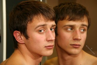 Blue-eyed twink showing his half-naked body