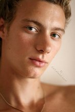 Close-ups of his face and his hairy cock