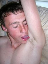 Hairy twink boy licking his own armpits on camera