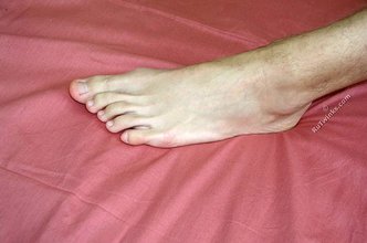 Blond-haired twink takes off his socks on camera
