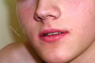 Blond-haired twink takes off his socks on camera