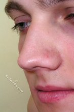 Blond-haired twink takes off his socks on camera