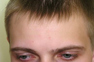 Blond-haired twink takes off his socks on camera